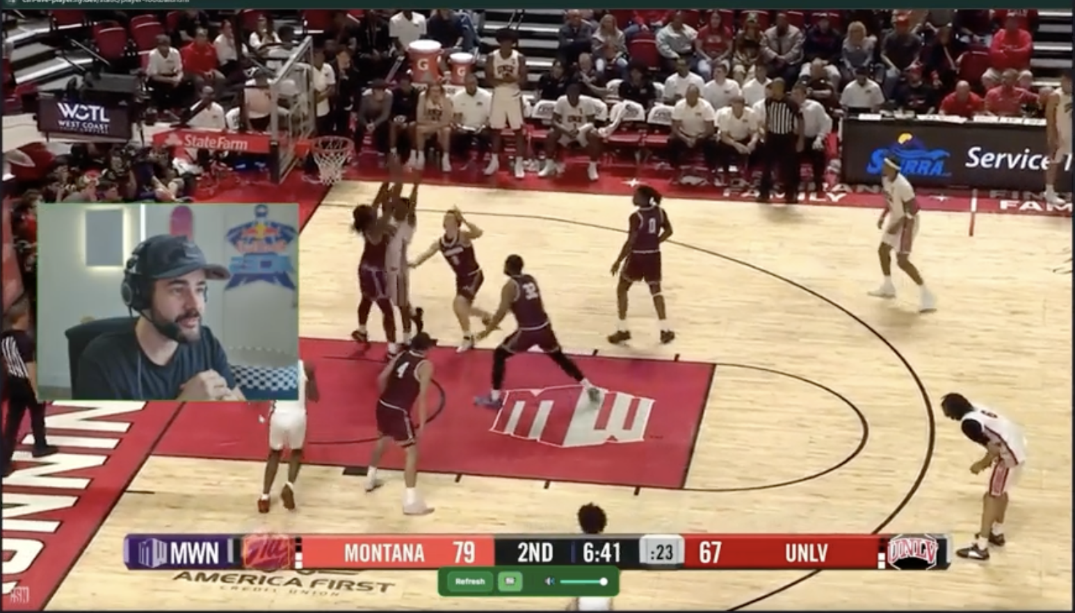 Creator broadcasting live sport with branded overlay
